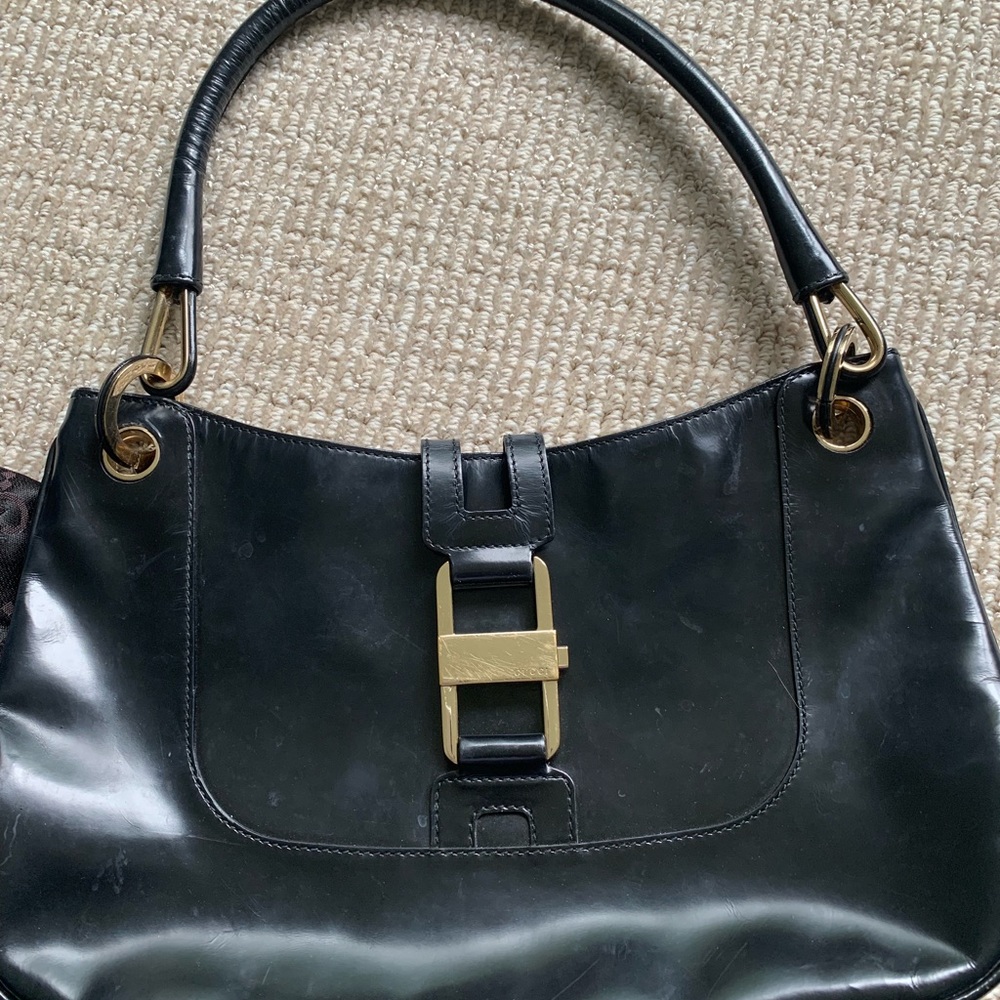 Gucci bag. Small black top handle,gold hardware.